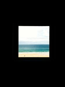 Beach seen through window